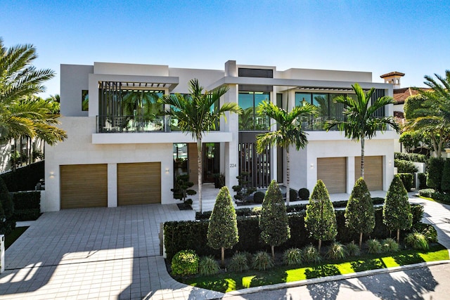 contemporary home with a balcony and a garage