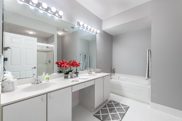 bathroom featuring tile patterned flooring, vanity, separate shower and tub, and a textured ceiling