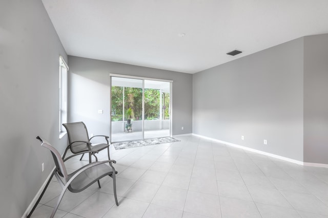 sitting room with light tile patterned floors