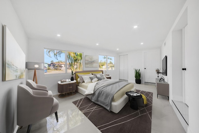 bedroom with recessed lighting and concrete floors