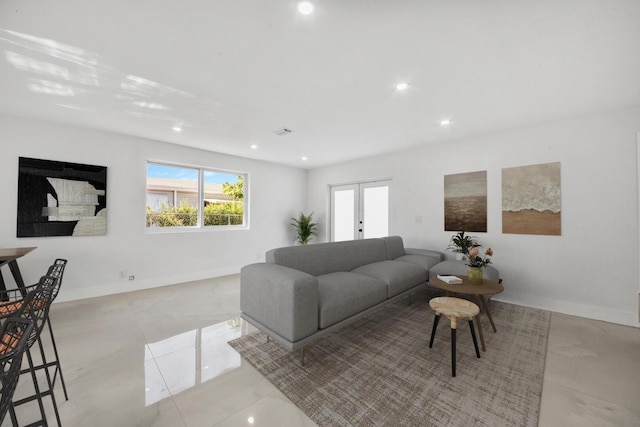 living room with visible vents, recessed lighting, baseboards, and french doors