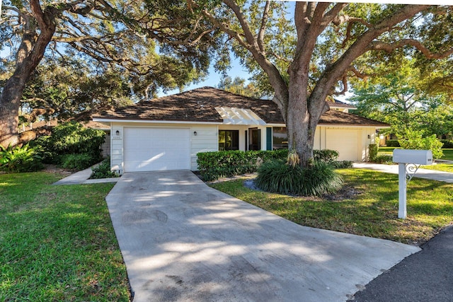 11282 Glen Oaks Ct Unit 31-C, North Palm Beach, FL 33408 - ranch-style home featuring driveway, a garage, and a front yard