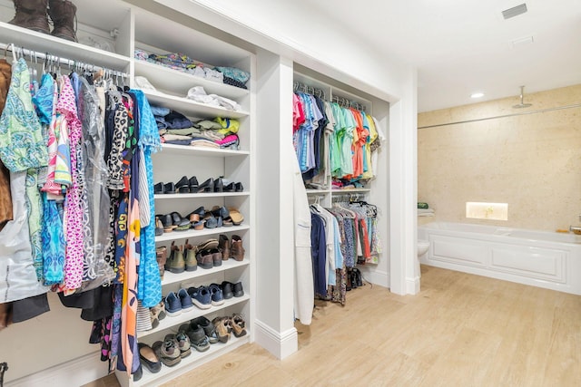 11282 Glen Oaks Ct Unit 31-C, North Palm Beach, FL 33408 - walk in closet with wood finished floors