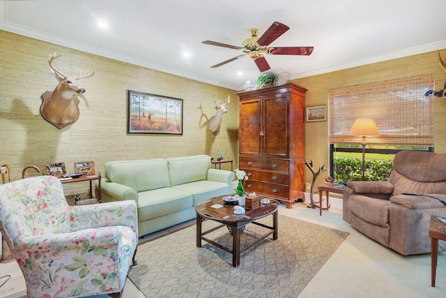 living room featuring ceiling fan and crown molding