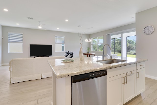 kitchen with dishwasher, sink, light hardwood / wood-style floors, a center island with sink, and white cabinets