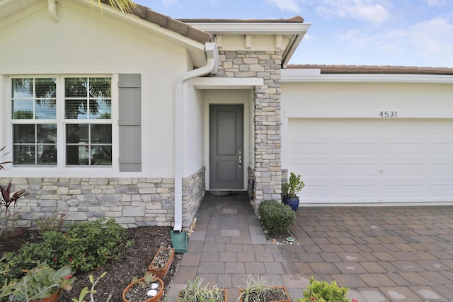 property entrance featuring a garage