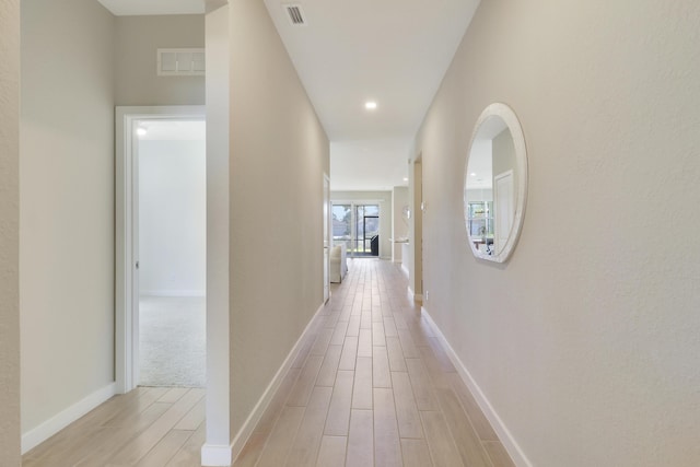 corridor featuring light hardwood / wood-style flooring