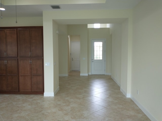 foyer featuring light tile patterned floors