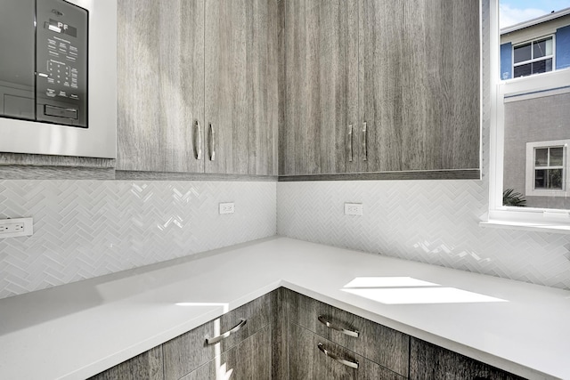 kitchen featuring dark brown cabinetry