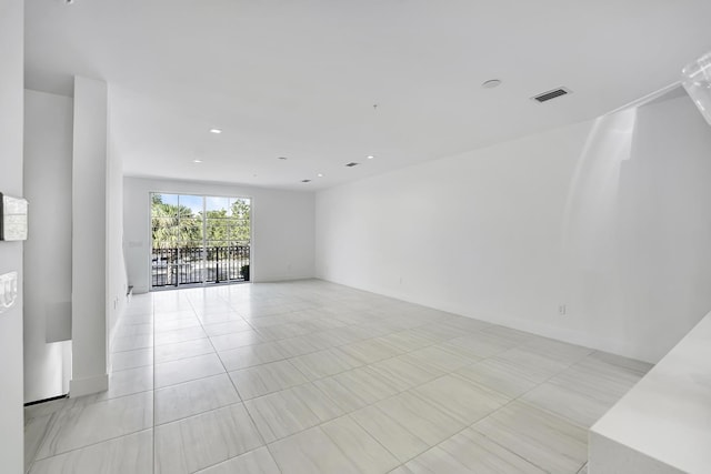 spare room with light tile patterned floors