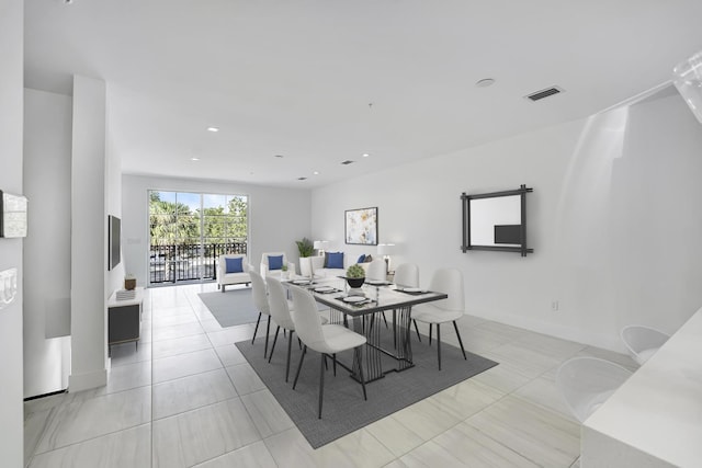 dining space with light tile patterned floors