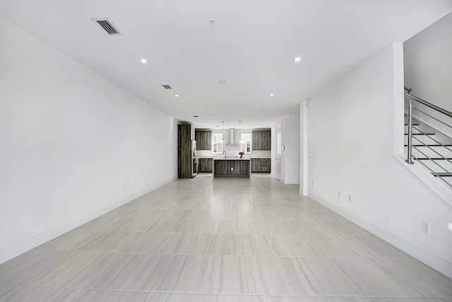 unfurnished living room with light tile patterned floors