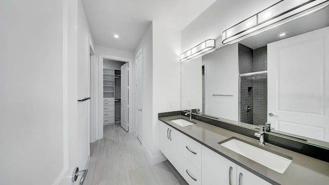 bathroom featuring vanity and a shower with door