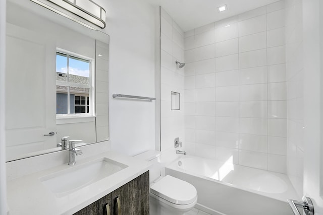 full bathroom featuring vanity, toilet, and tiled shower / bath