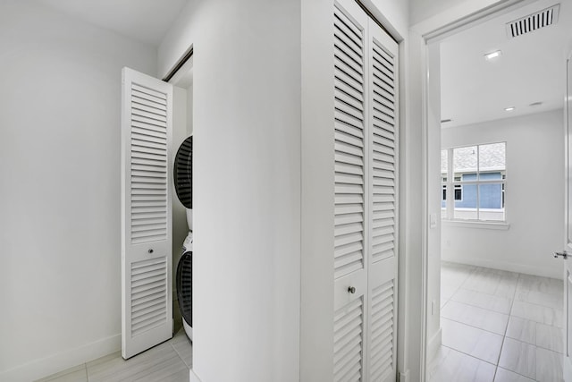 corridor with light tile patterned flooring