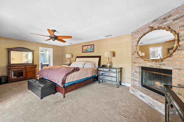 bedroom with carpet, ceiling fan, and a textured ceiling