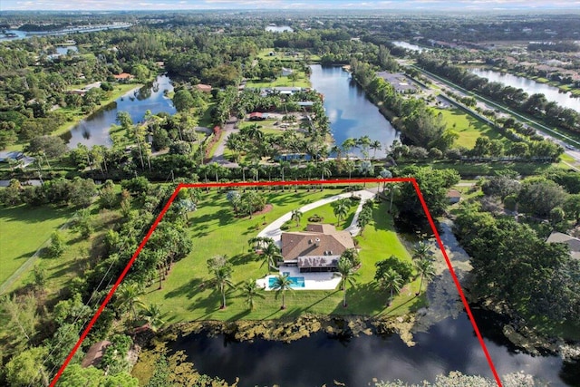 birds eye view of property with a water view