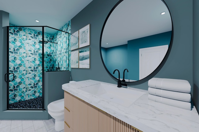 bathroom with tile patterned floors, vanity, a shower with shower door, and toilet