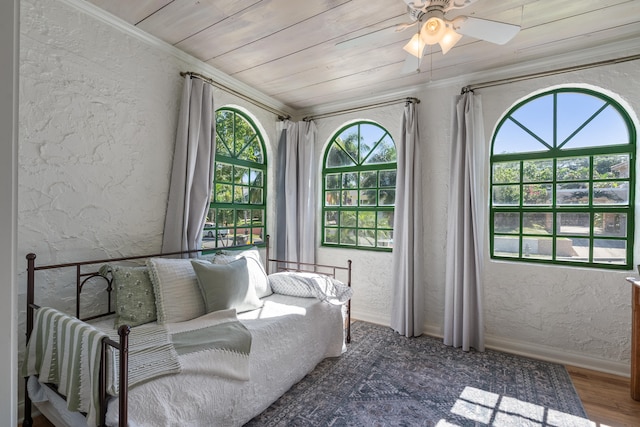 sunroom / solarium with ceiling fan and wooden ceiling