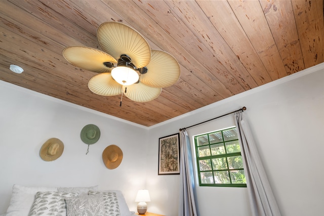 bedroom featuring ceiling fan, crown molding, and wood ceiling