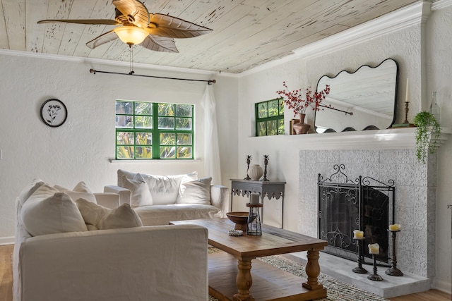 living room featuring hardwood / wood-style flooring, wooden ceiling, and crown molding