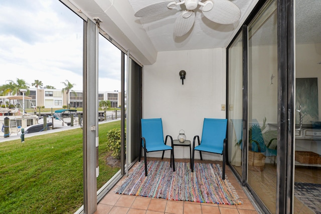 sunroom / solarium with ceiling fan