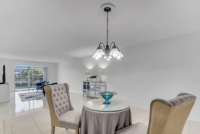 dining area featuring light tile patterned floors and an inviting chandelier