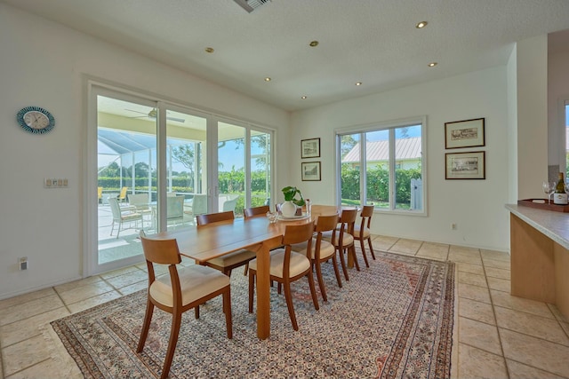 dining room featuring a textured ceiling