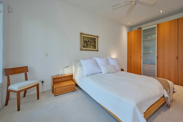 carpeted bedroom featuring ceiling fan