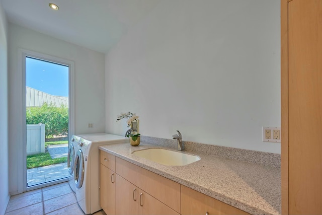 laundry room featuring washer and clothes dryer and sink