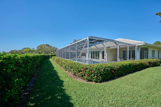 view of yard featuring a lanai