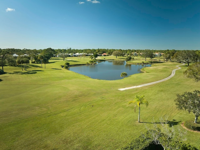 view of home's community featuring a yard and a water view