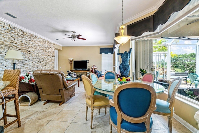 7580 Red River Rd, West Palm Beach, FL 33411 - dining space with plenty of natural light, ornamental molding, ceiling fan, light tile patterned flooring, and a textured ceiling