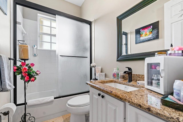 7580 Red River Rd, West Palm Beach, FL 33411 - bathroom with vanity, toilet, and combined bath / shower with glass door