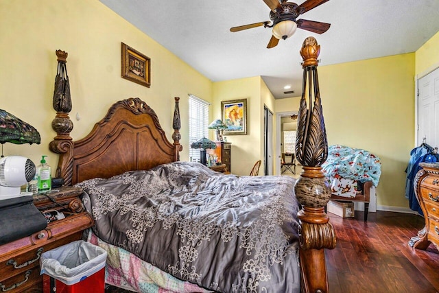 bedroom featuring ceiling fan, a closet, and dark hardwood / wood-style floors