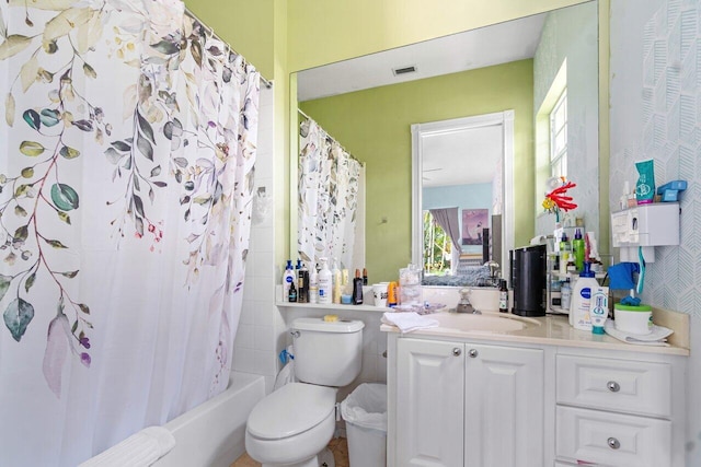 full bathroom featuring vanity, toilet, and shower / bath combo