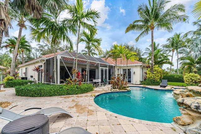 view of pool with a lanai and a patio area