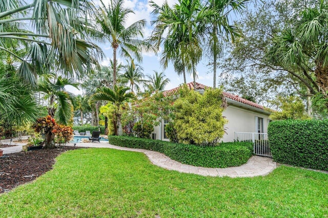 7580 Red River Rd, West Palm Beach, FL 33411 - view of green lawn with an outdoor pool