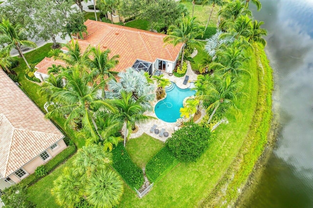 birds eye view of property with a water view