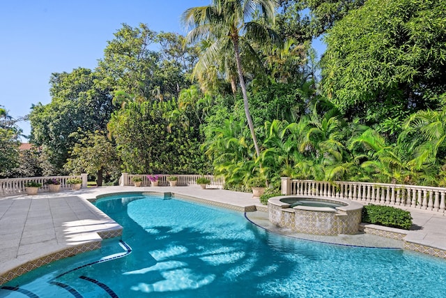 view of pool featuring an in ground hot tub and a patio area