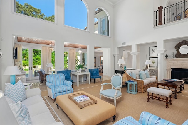 living room featuring french doors and a high ceiling