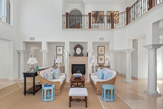 living room with crown molding and a towering ceiling