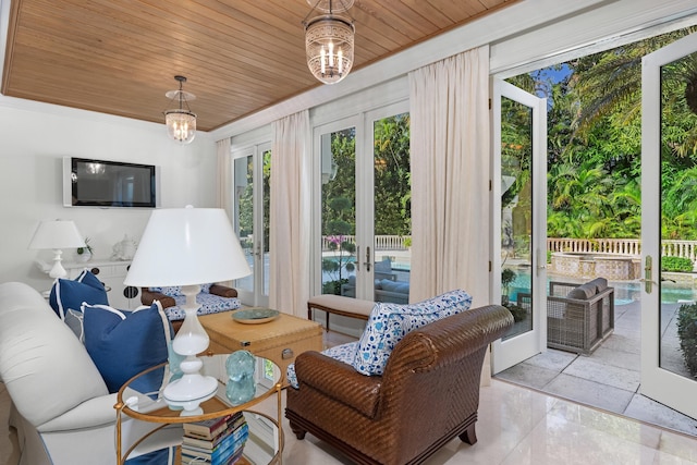 living room featuring french doors, an inviting chandelier, wooden ceiling, and light tile patterned flooring