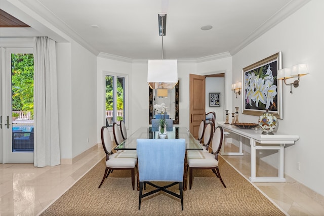 tiled dining room featuring ornamental molding