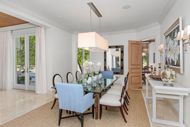 dining area with ornamental molding and french doors