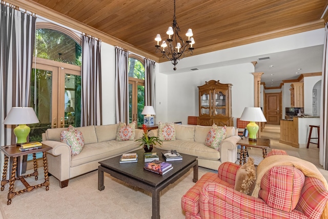 living room with wooden ceiling, ornamental molding, and a notable chandelier