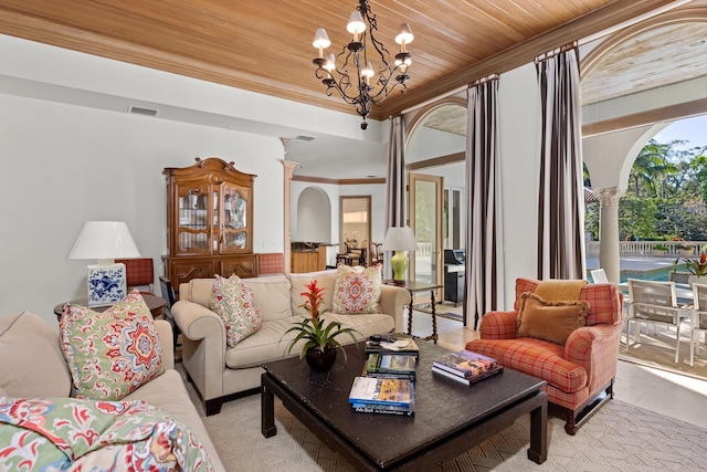 living room with wood ceiling, decorative columns, an inviting chandelier, crown molding, and light tile patterned flooring