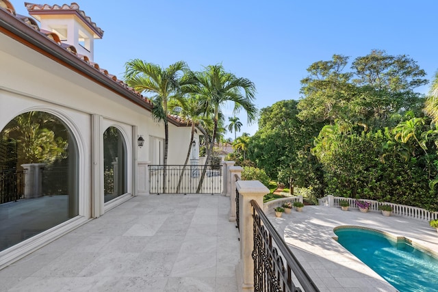 exterior space featuring a fenced in pool