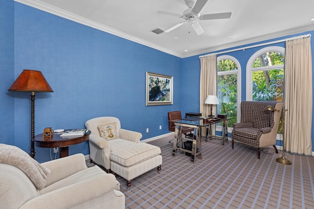 sitting room featuring ceiling fan, carpet floors, and ornamental molding