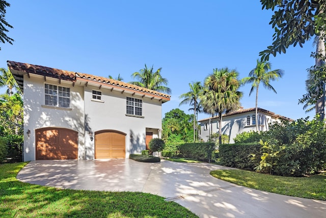 mediterranean / spanish-style home featuring a garage